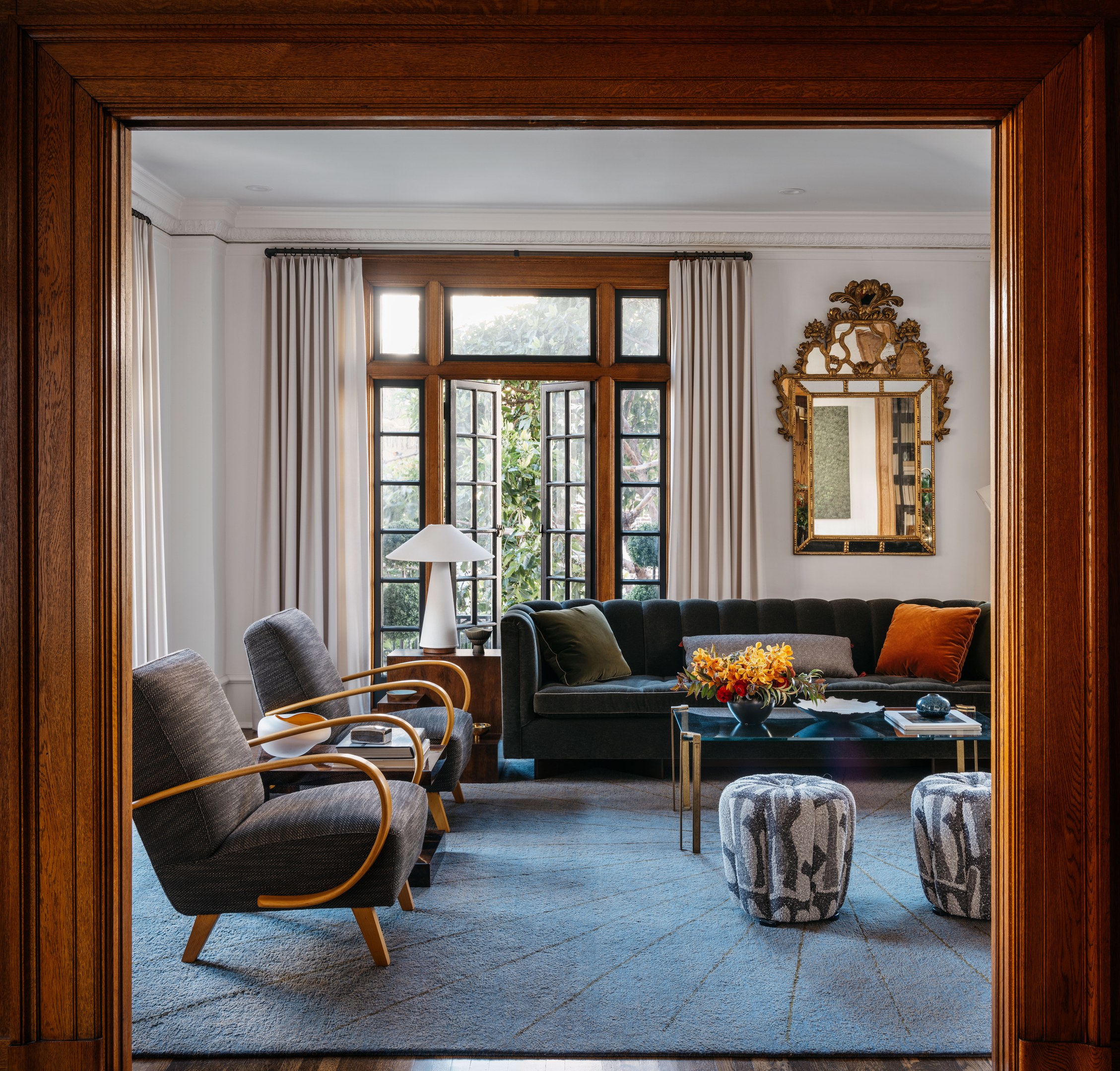 Patterned upholstered ottomans in a JKA sitting room